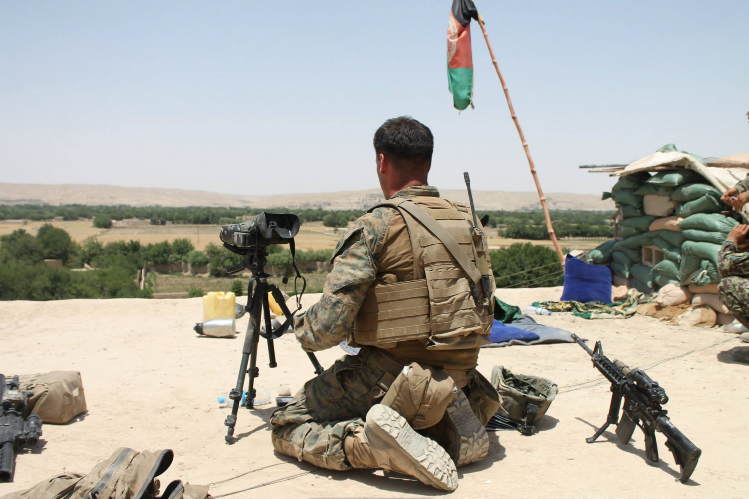 Marine JTAC Justin Cramer on Sangin, Afghanistan rooftop with thermal optics